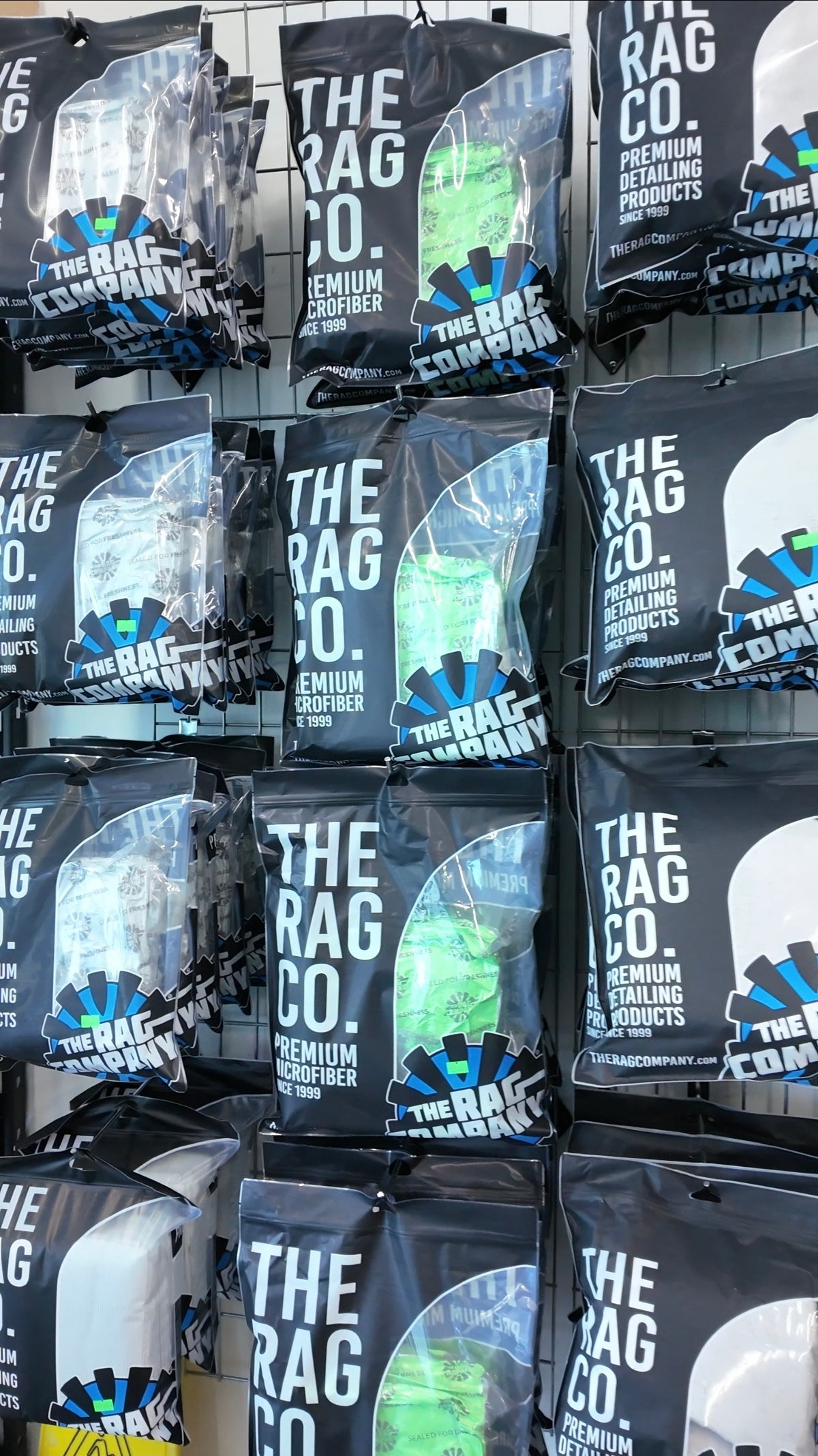 The Rag Company microfiber towels on the wall at Detail Supplies of Houston